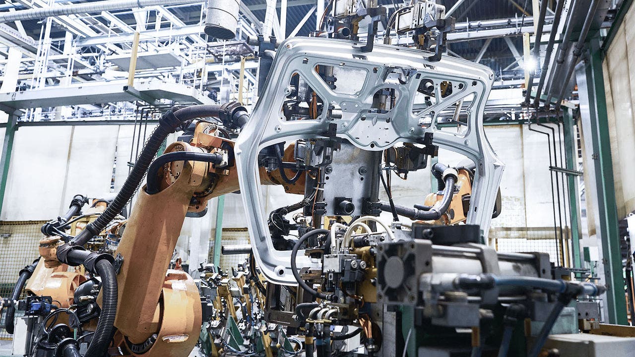 Robot welder operates with car body part in factory workshop; Shutterstock ID 2306746571; purchase_order: Braun, Corina